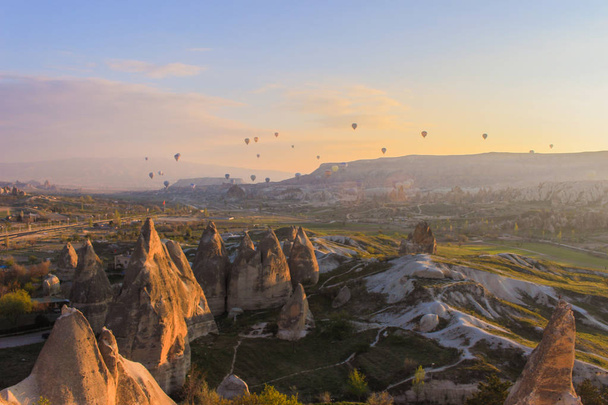 Turkey. Cappadocia. Morning. Sunrise. Caves. Balloons - Фото, изображение