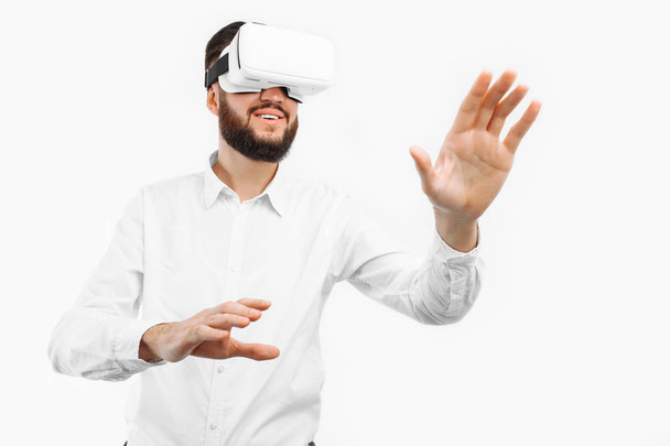 a man in virtual glasses, presses his finger on an empty space on - Foto, Imagem