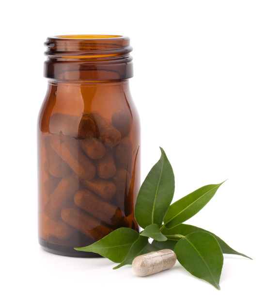 Herbal drug capsules in brown glass bottle. Alternative medicine - Photo, Image