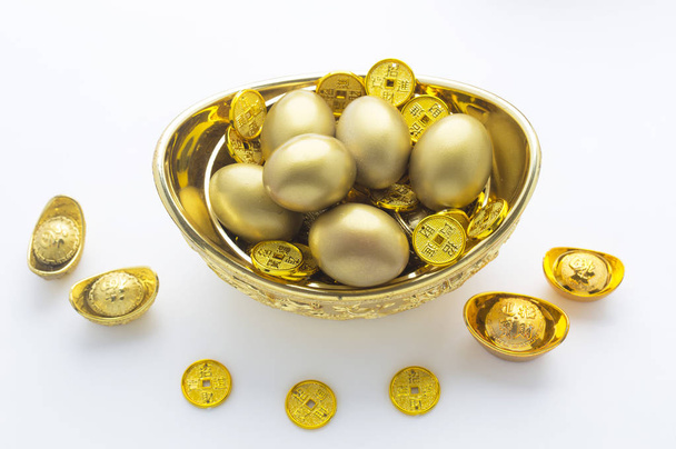 Gold eggs on background,close up - 写真・画像