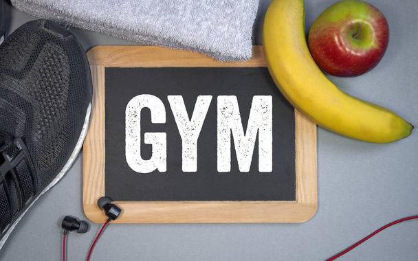 Chalkboard with diet and gym with sport shoes and nutrition - Foto, afbeelding