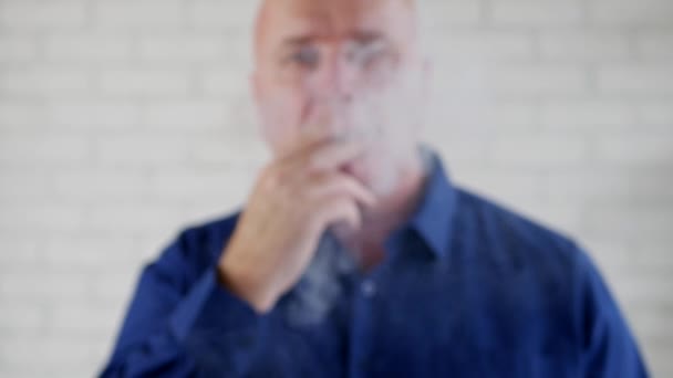 Image with a Man Smoking Making a Lot of Smoke Offering a Lighted Cigarette - Záběry, video