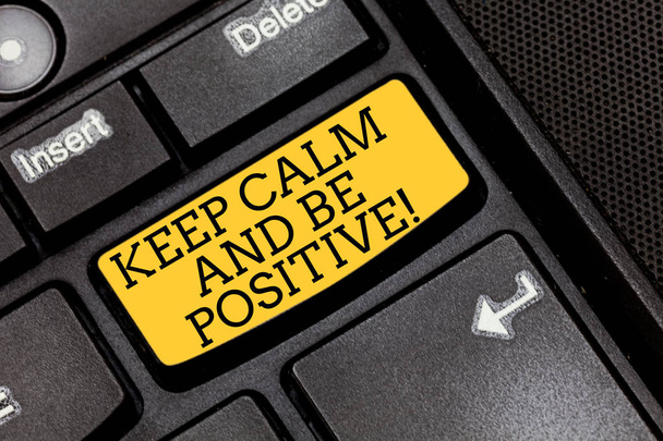 Handwriting text writing Keep Calm And Be Positive. Concept meaning Stay calmed positivity happiness smiling Keyboard key Intention to create computer message pressing keypad idea. - Photo, Image