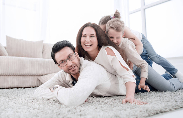 Happy family at home spending time togethe - Фото, изображение