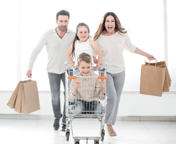 happy family with cart and kids - Zdjęcie, obraz