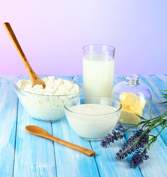 Glass of milk and cheese on light background - Photo, image