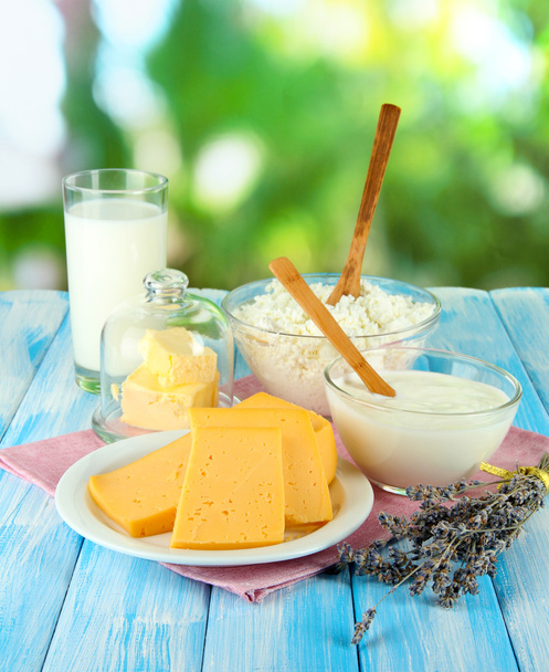 Glass of milk and cheese on natural background - Fotografie, Obrázek