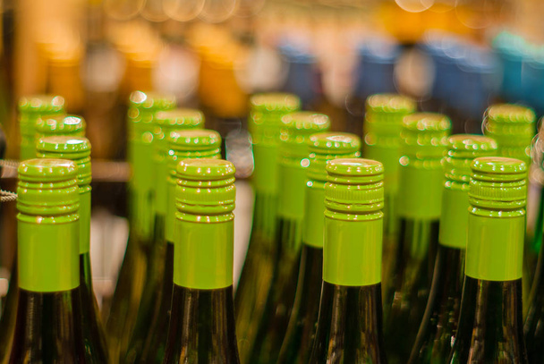 Close-up of bottlenecks in bottles in a drawer - Photo, Image