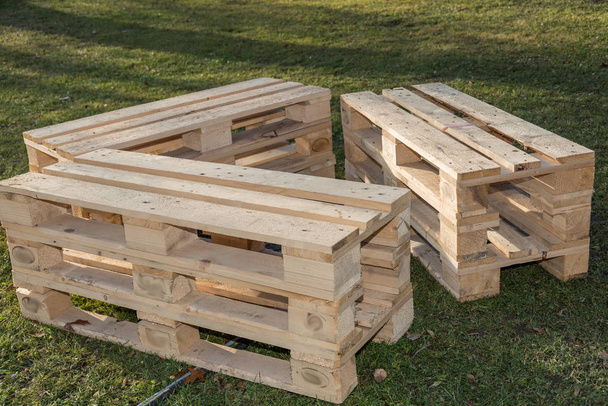 rustic and alternative seat set made of renewable raw material wood - upcycling wooden pallets - Photo, Image