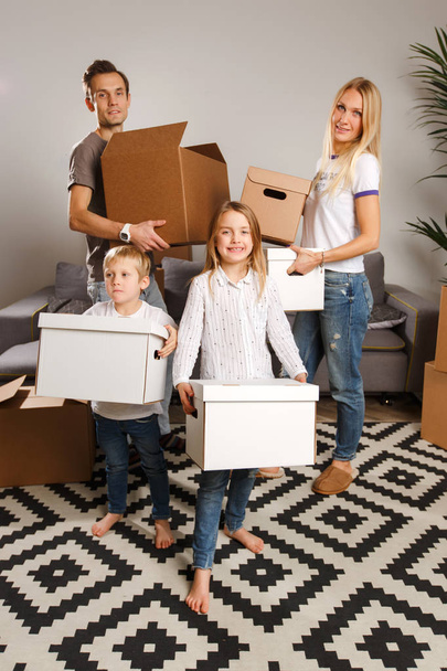Picture of women, men and children holding cardboard boxes - Photo, Image