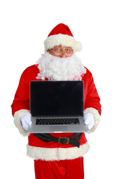 Santa Claus with laptop, isolated on white background. - Foto, Imagen