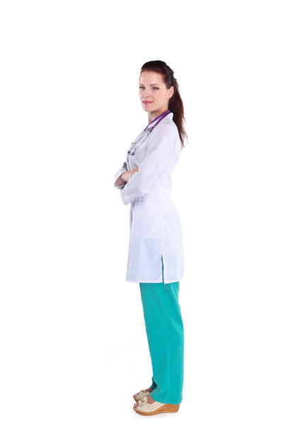 Smiling female doctor with a folder in uniform standing at hospital. Smiling female doctor - Photo, image