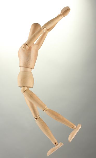 wooden mannequin, on grey background - Photo, Image