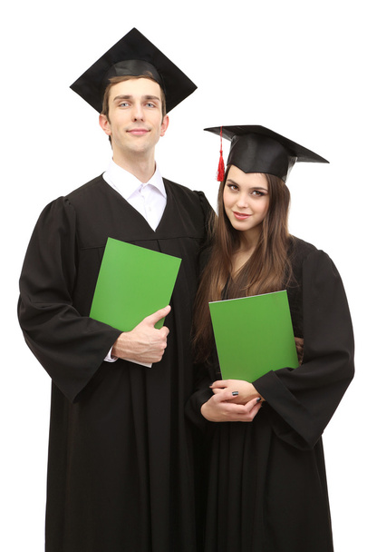 Two happy graduating students holding graduation certificate isolated on white - Foto, Bild