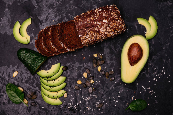 Food, avocado, healthy food. Avocado and brown bread. It can be used as a background - Photo, Image