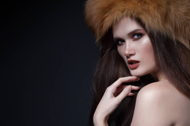 young model beauty portrait. woman with fox fur. winter chic. beautiful earring - Photo, Image