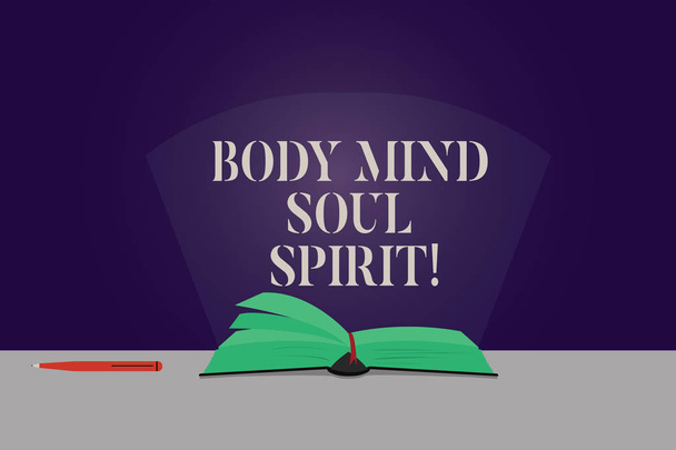 Word writing text Body Mind Soul Spirit. Business concept for Healthy lifestyle emotional balance Spiritual feelings Color Pages of Open Book photo on Table with Pen and Light Beam Glaring. - Photo, Image