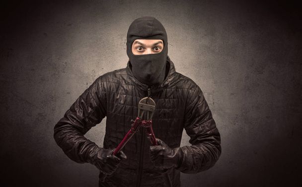 Burglar with tool. - Foto, Bild