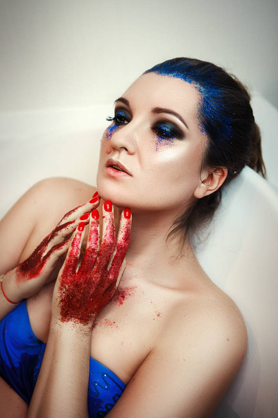 Model is posing in a bath with glitters - Фото, зображення