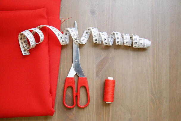 Fabric, scissors, thread, measuring tape. Sewing supplies. - Foto, Imagem
