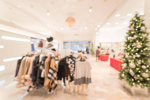 Sfocato movimento clienti shopping presso negozio di abbigliamento di lusso nel centro di Dallas, Texas, Stati Uniti durante le festività natalizie. Scarpe costose sfocate, borse, gioielli, accessori, prodotti di bellezza
 - Foto, immagini