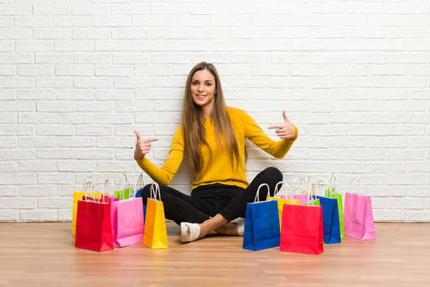 Young girl with lot of shopping bags proud and self-satisfied in love yourself concept - Fotografie, Obrázek