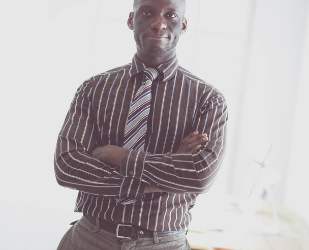 Portrait of an handsome black businessman standing in office - Fotoğraf, Görsel