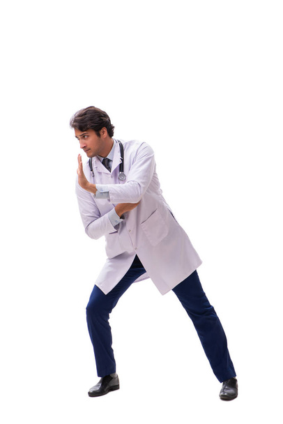 Молодой красивый доктор под давлением изолирован на белом
 - Фото, изображение
