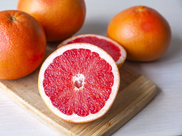 Ripe fresh grapefruits on a table - Fotoğraf, Görsel