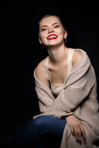 portrait of smiling woman on black background - 写真・画像