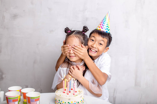 Close-up photo of happy boy wants to give gift to his friend on her birthday - Foto, Imagen