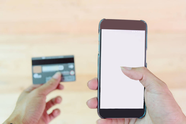 use credit card for shopping online by smartphone / hold credit card for shopping online by smartphone - Фото, зображення