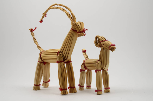 two traditional christmas straw goats on a white background - Photo, Image