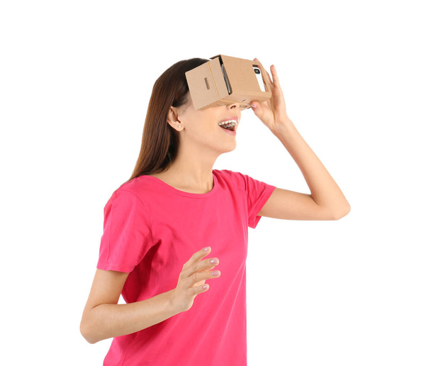 Young woman using cardboard virtual reality headset, isolated on white - Fotografie, Obrázek