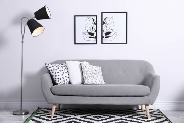 Comfortable sofa with pillows in modern living room interior - Valokuva, kuva