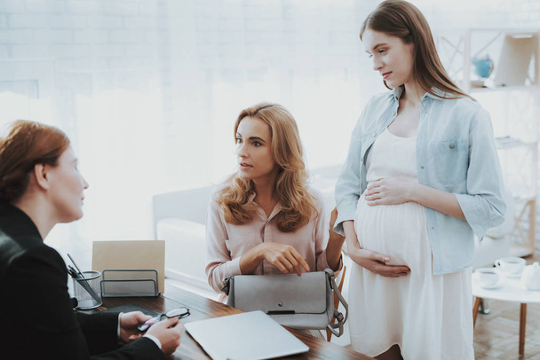 Mother with Pregnant Daughter in Doctor Office. Visit to Family Doctor. Consulting Psychologist. Healthy Pregnancy Concept. Young Mother. Worried Mother. Pregnant Girl. Psychological Help. - Fotoğraf, Görsel