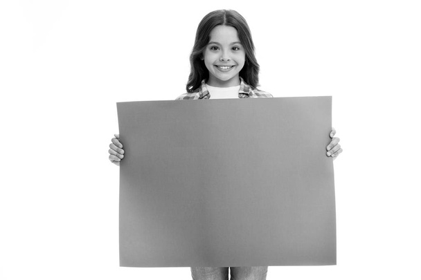 advertisement. little girl hold paper for advertisement. advertisement child with place for copy space. advertisement and presenting product concept. yout advertising here - Foto, Imagem
