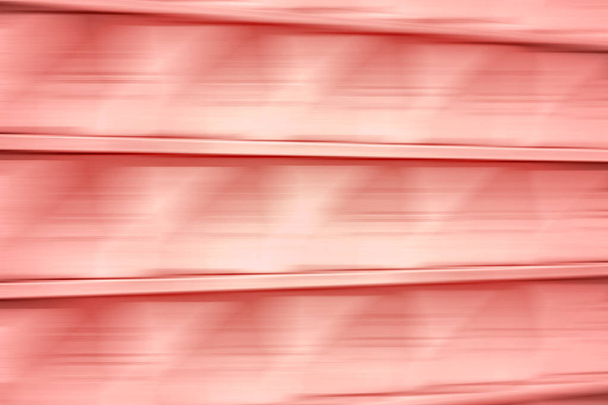 Abstract motion blurred background, toned with PANTONE Living Coral color. - Photo, Image