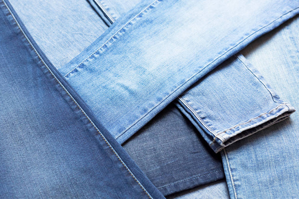 Background and texture of lot of different blue jeans - Foto, immagini