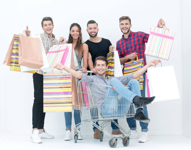 cheerful group of young people with shopping - Photo, image