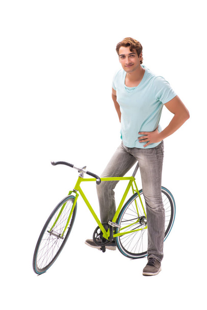 Young man riding a bicycle isolated on white background - Фото, изображение