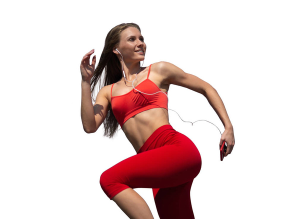 Young fitness woman running on white background. The concept of a healthy lifestyle - Foto, imagen
