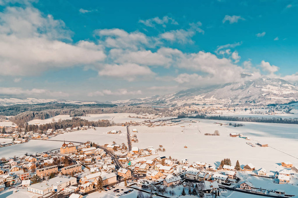 Gruyeres town village and Alps mountains landscape in Switzerland in winter - Photo, Image