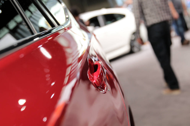 Modern red car. Car handle. Auto show - Photo, Image