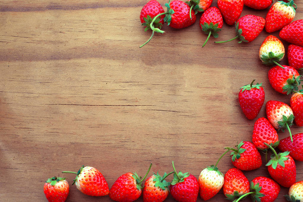 Strawberry fresh berries on a wood background. - Valokuva, kuva