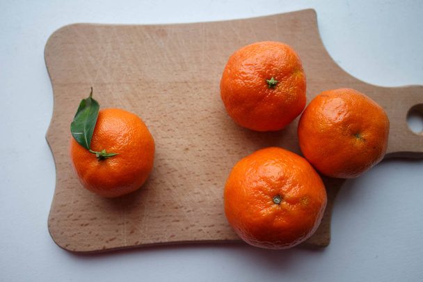 ripe tangerines on a wooden deck - Photo, Image