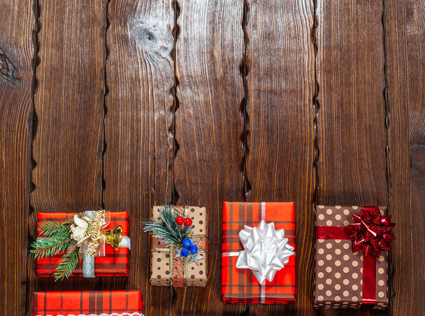 Christmas gifts with christmas decoration on wooden background closeup - Photo, Image