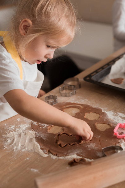 Baby Makes Christmas Cookies. Christmas Concept. Bakery products. Children Training - Photo, Image