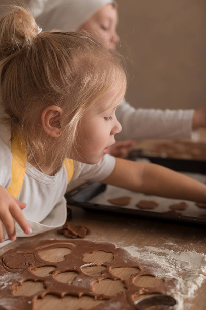 Baby Makes Christmas Cookies. Christmas Concept. Bakery products. Children Training - 写真・画像