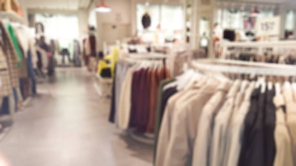fashionable boutique clothing store shop in shopping mall defocused blur background - Photo, Image